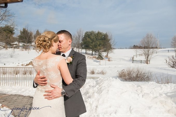 Bride and groom embracing outdoors