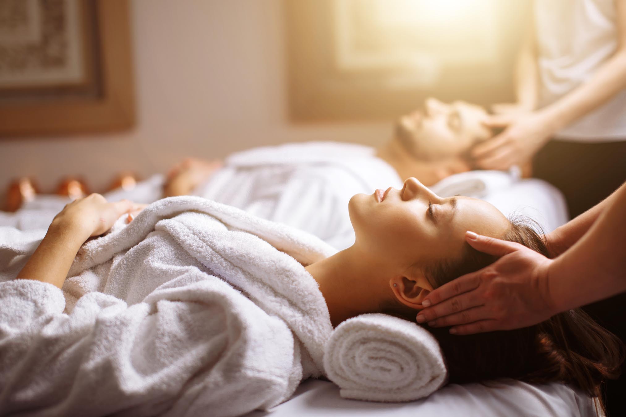 Couple getting head massages
